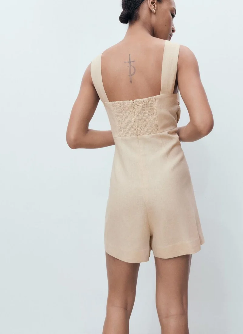MANGO Linen jumpsuit with hoop detail