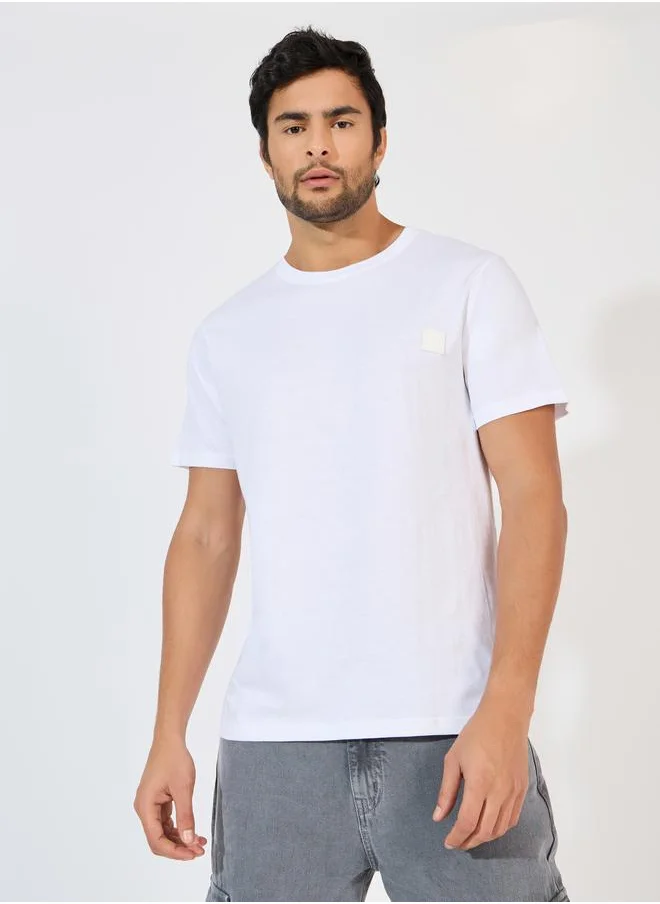 Styli Styli Crew Neck Regular Fit T-Shirt with Silicon Badge