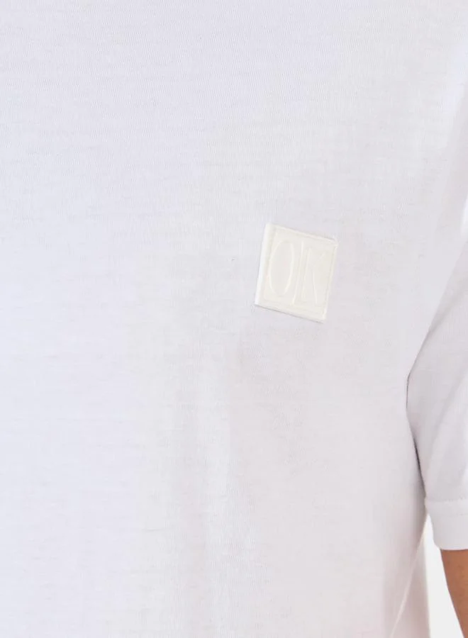 Styli Styli Crew Neck Regular Fit T-Shirt with Silicon Badge