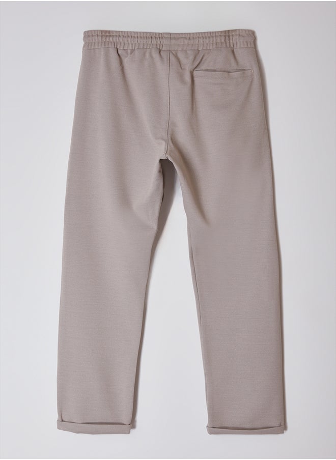 trendyol - Beige Regular Fit Knitted Flexible Comfortable Waist Tied Elastic Double Leg Fabric Trousers TMNAW25PL00002 - Image 1