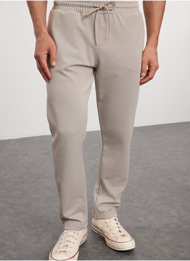 trendyol - Beige Regular Fit Knitted Flexible Comfortable Waist Tied Elastic Double Leg Fabric Trousers TMNAW25PL00002 - Image 1