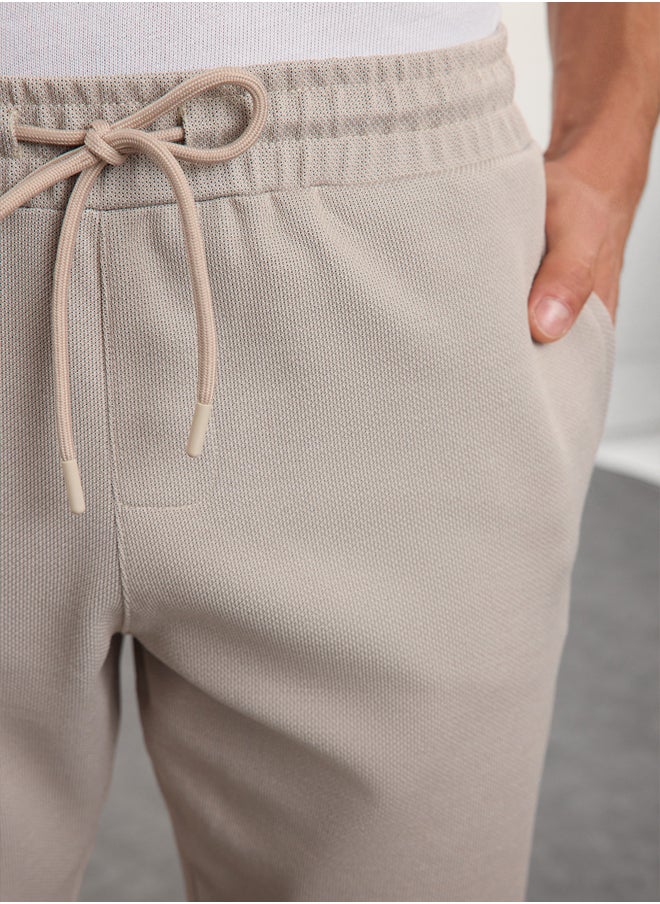 trendyol - Beige Regular Fit Knitted Flexible Comfortable Waist Tied Elastic Double Leg Fabric Trousers TMNAW25PL00002 - Image 1