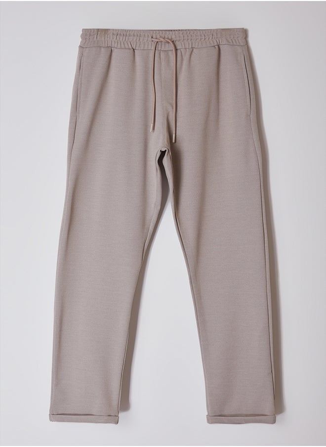trendyol - Beige Regular Fit Knitted Flexible Comfortable Waist Tied Elastic Double Leg Fabric Trousers TMNAW25PL00002 - Image 1