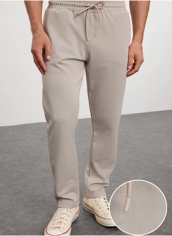 trendyol - Beige Regular Fit Knitted Flexible Comfortable Waist Tied Elastic Double Leg Fabric Trousers TMNAW25PL00002 - Image 1