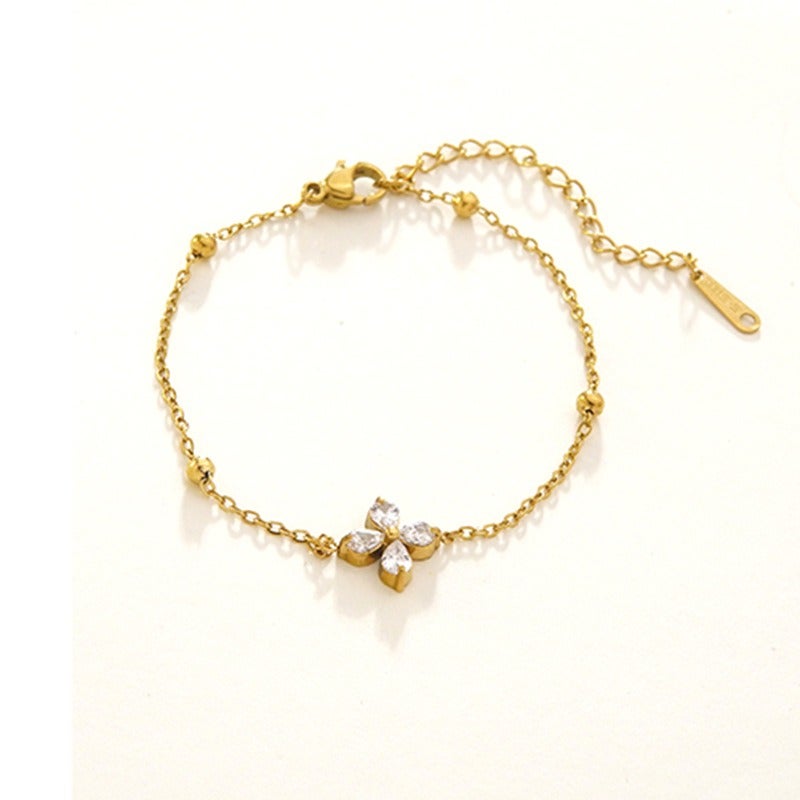 Luxury Stainless Steel Four-Leaf Clover Bracelet with 18K Gold Plating and Zirconia - Elegant, Versatile, and Trendy