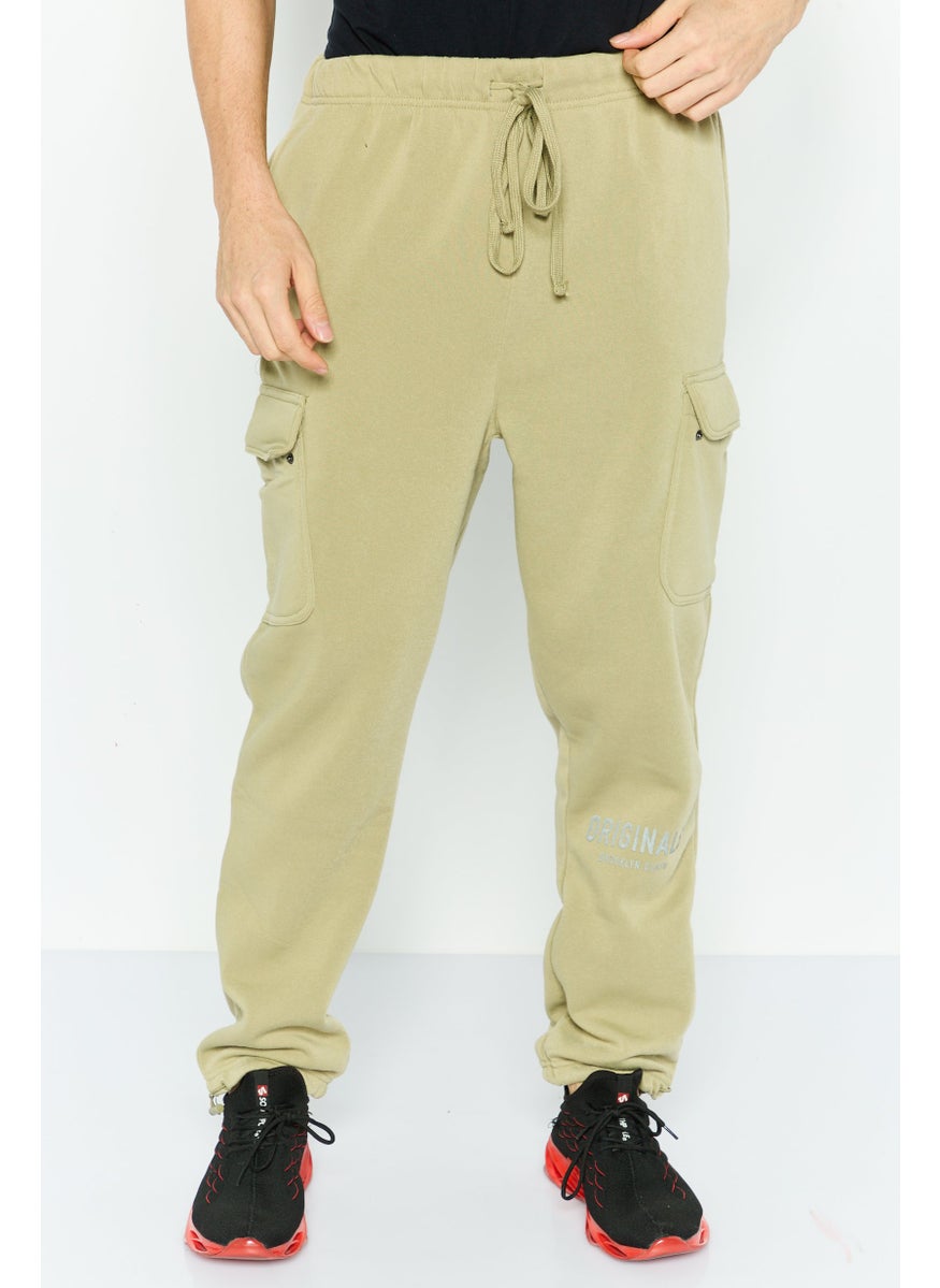 Men Regular Fit Brand Logo Cargo Sweatpants, Olive - pzsku/ZC85F9F4C87E1831A8BEDZ/45/_/1739455620/5728ed95-05dc-46bd-8e45-106263ab19af