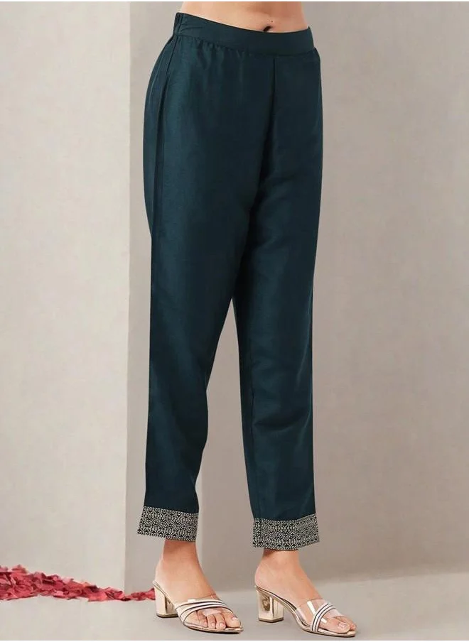 ISHIN Polyester Women Green Polyester Kurta Set with Embroidered pattern Tunic and Palazzo features a Round neckline and Three-Fourth Sleeve secured with Elastic closure and styled in Straight Fit ideal for Festive moments — designed to make heads turn.