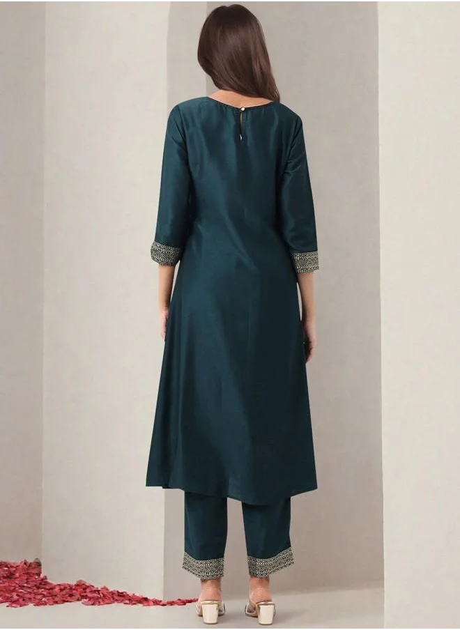 ISHIN Polyester Women Green Polyester Kurta Set with Embroidered pattern Tunic and Palazzo features a Round neckline and Three-Fourth Sleeve secured with Elastic closure and styled in Straight Fit ideal for Festive moments — designed to make heads turn.