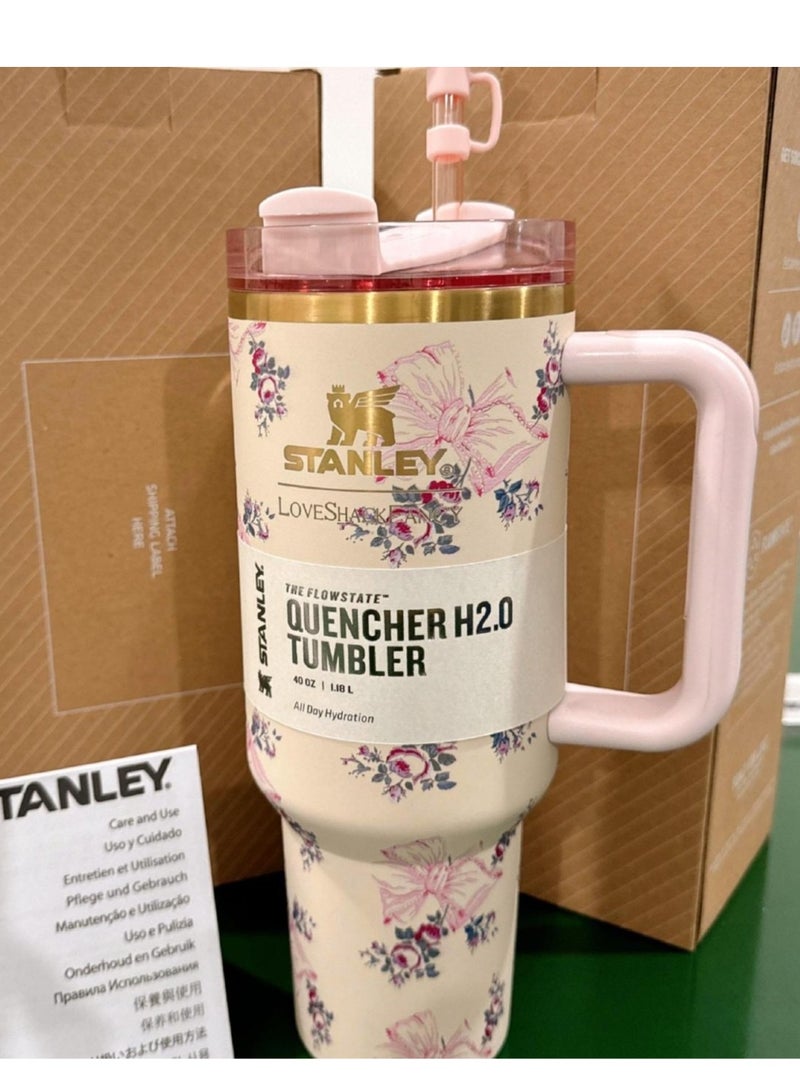 Stanley Quencher H2.0 FlowState Stainless Steel Vacuum Insulated Tumbler with Lid and Straw for Water, Iced Tea or Coffee, Smoothie and More, 40 oz, Pink bow - Image 1