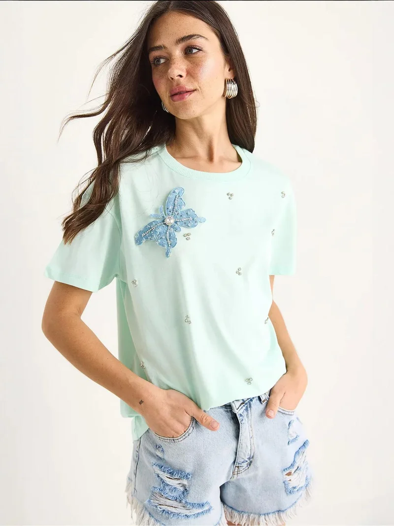 بيانكو لوتشي تيشيرت لوكسي مطرز بياقة دائرية