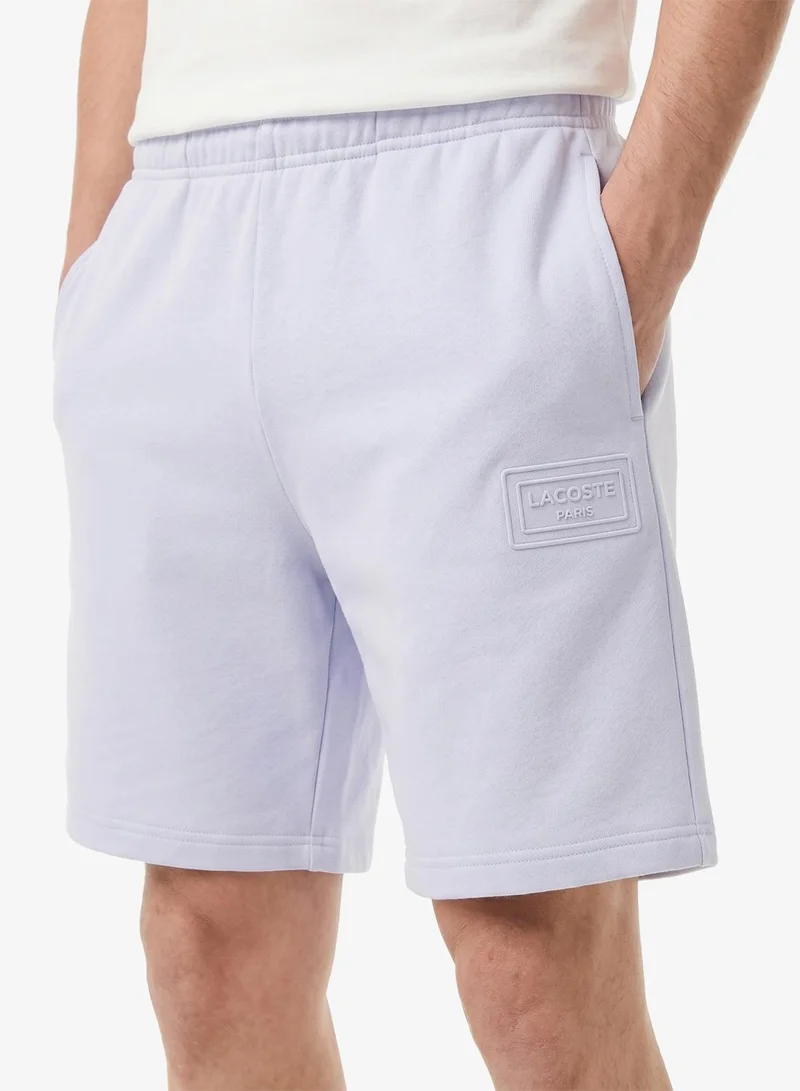 Lacoste  Regular Fit Embossed Unbrushed Fleece Shorts for Men | Best Price UAE