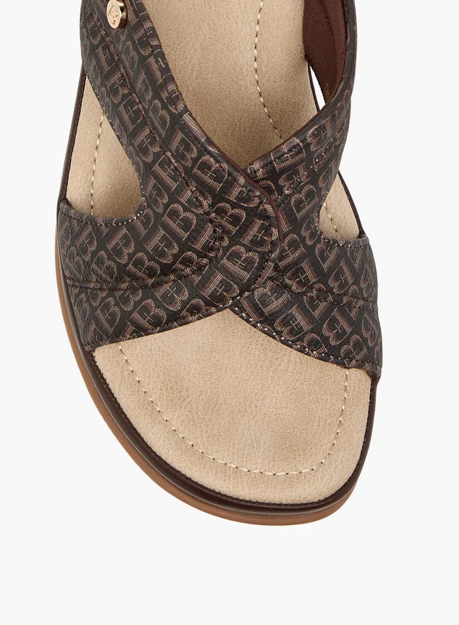 فلورا بيلا من شو إكسبرس Monogram Print Slip-On Sandals with Wedge Heels