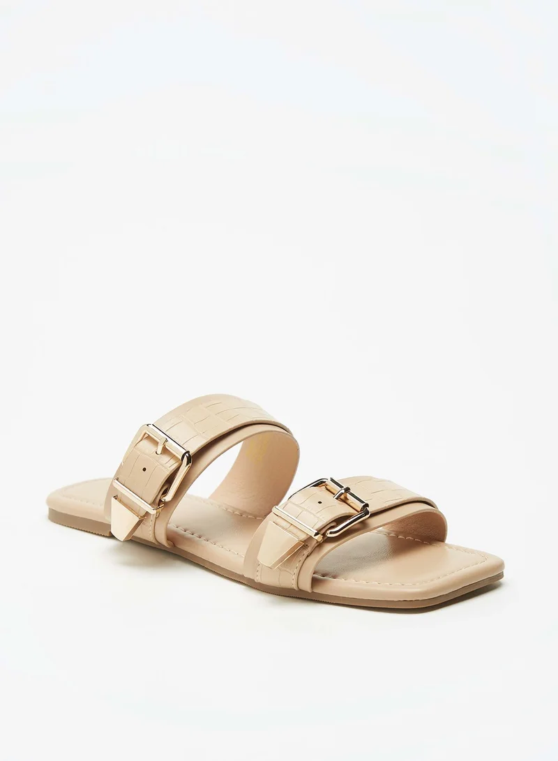 فلورا بيلا من شو إكسبرس Womens Textured Slip-On Dual Strap Slide Sandals with Buckle Accent