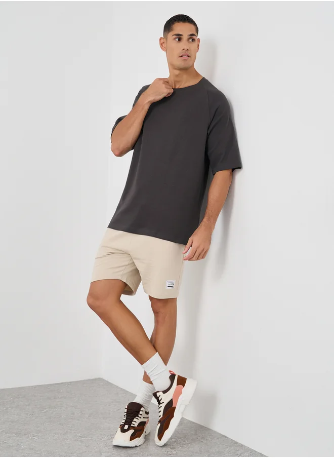 Styli Styli Men Solid Raglan Sleeves Oversized T-Shirt
