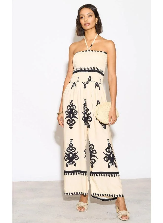 Hoxton Gal Beige Printed Jumpsuit – Strapless Tie‑Neck, Shirred Bodice & Wide Legs