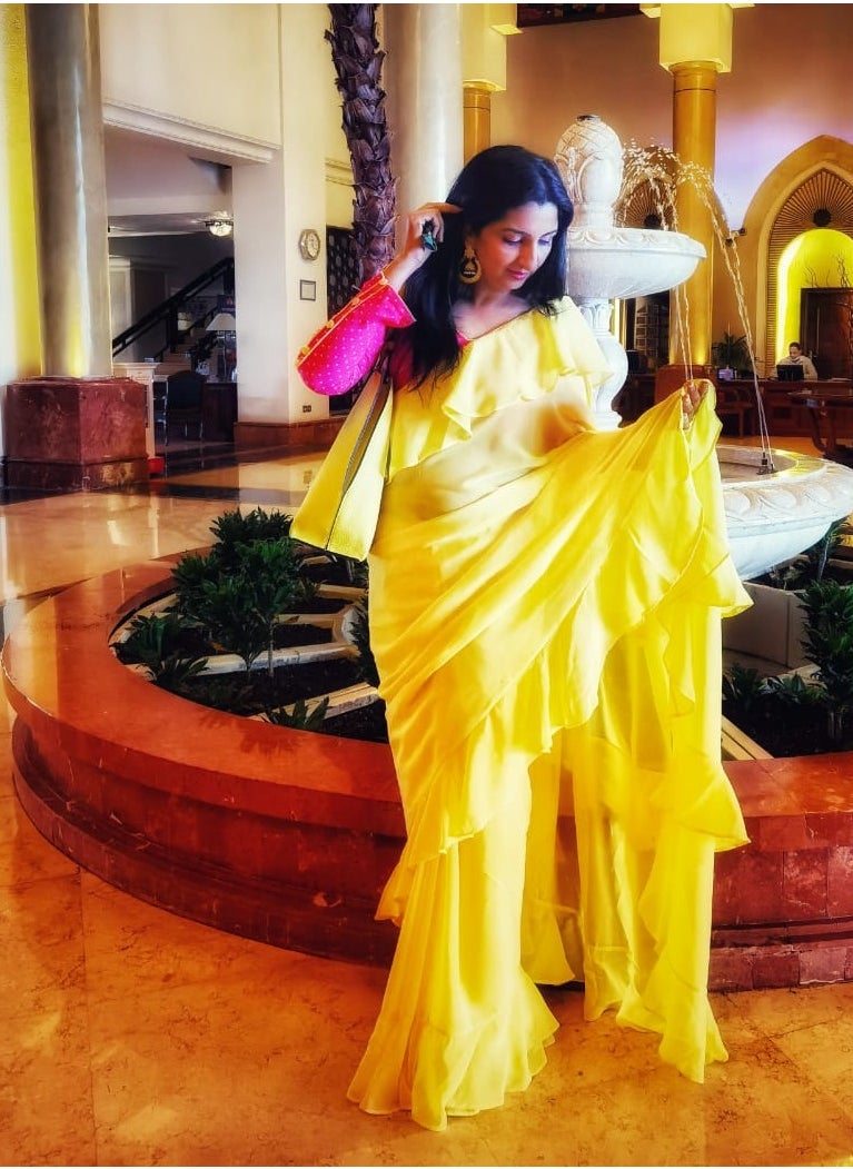 Grab Mantra Georgette Yellow Ruffle Saree With Contrast Pink Unstitched Blouse  - Image 2