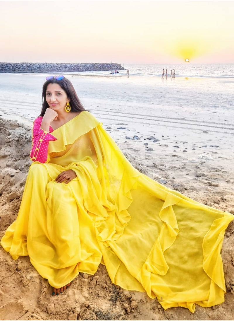 Grab Mantra Georgette Yellow Ruffle Saree With Contrast Pink Unstitched Blouse  - Image 3