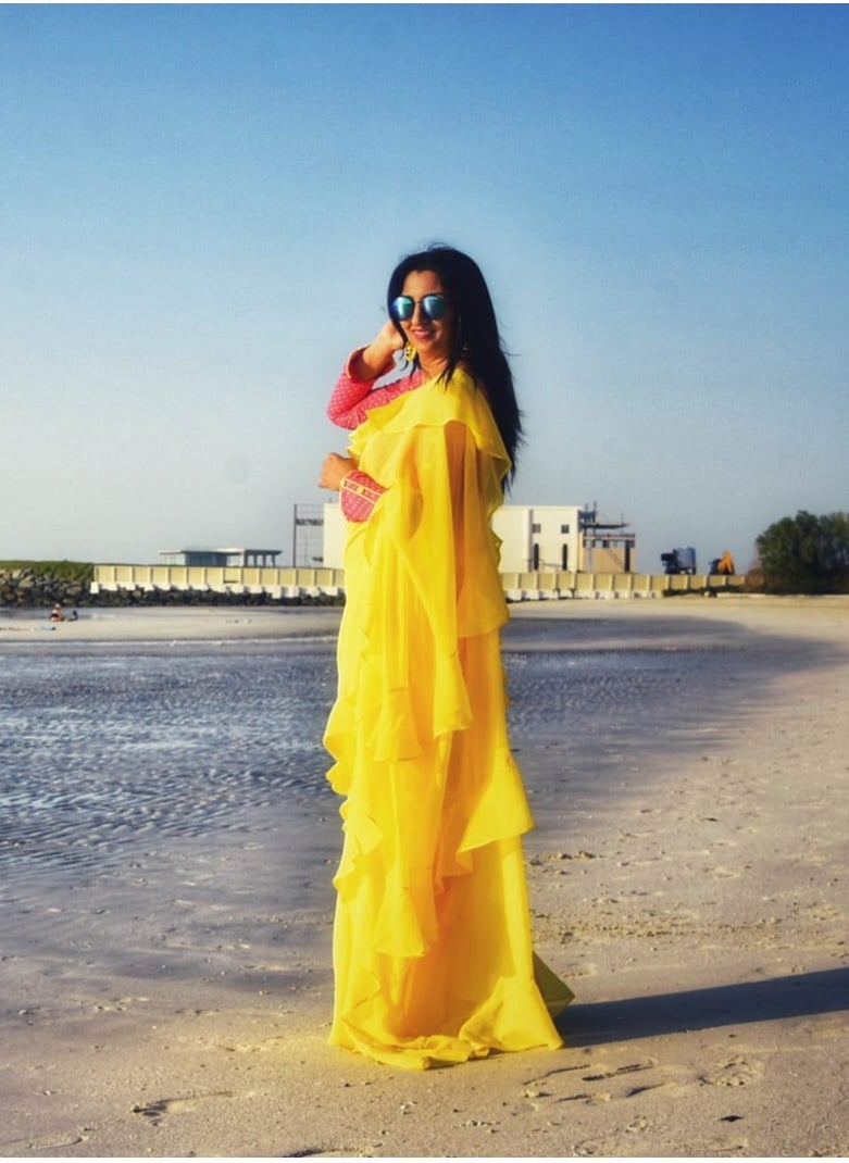 Grab Mantra Georgette Yellow Ruffle Saree With Contrast Pink Unstitched Blouse  - Image 5