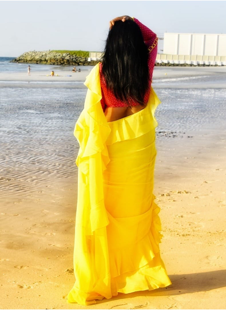 Grab Mantra Georgette Yellow Ruffle Saree With Contrast Pink Unstitched Blouse  - Image 4