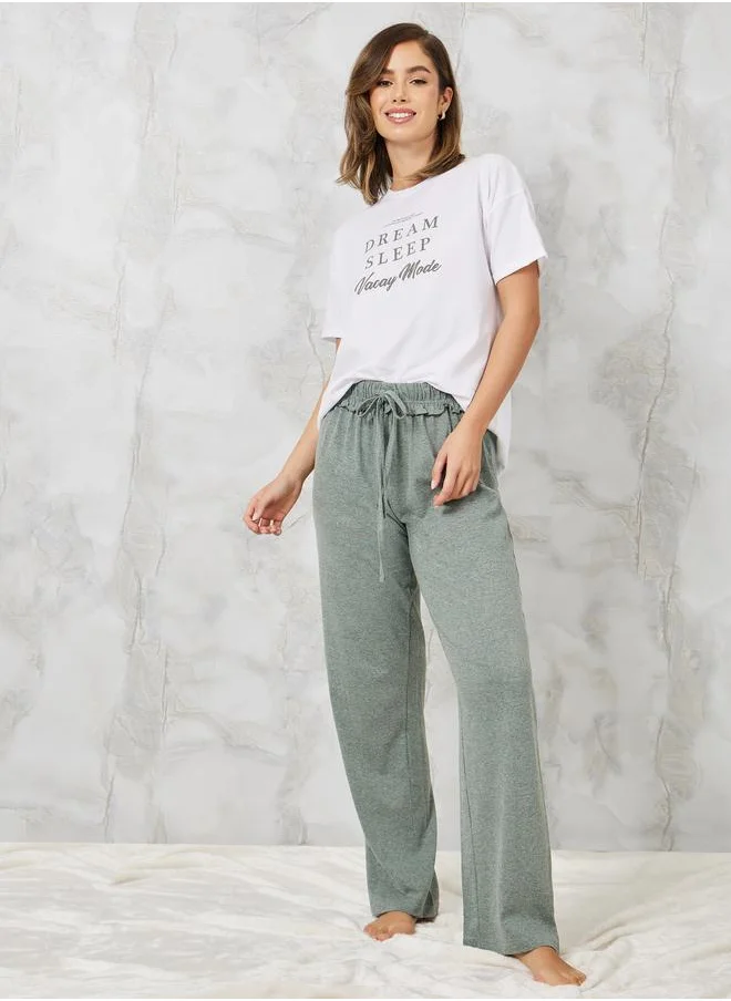 ستايلي Styli Slogan Printed T-Shirt and Ruffle Waist Pyjama Set