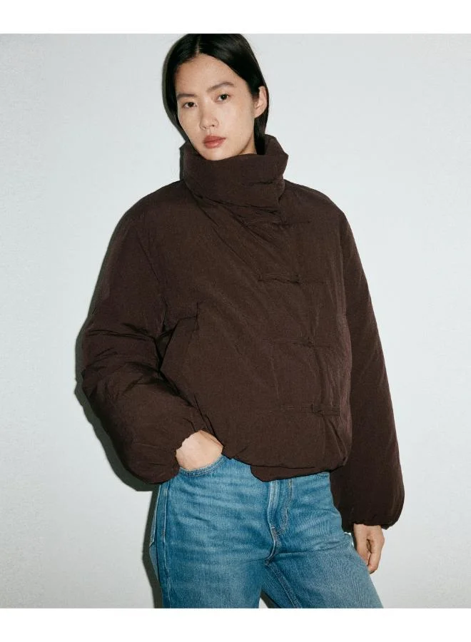 Padded anorak with toggle fastenings