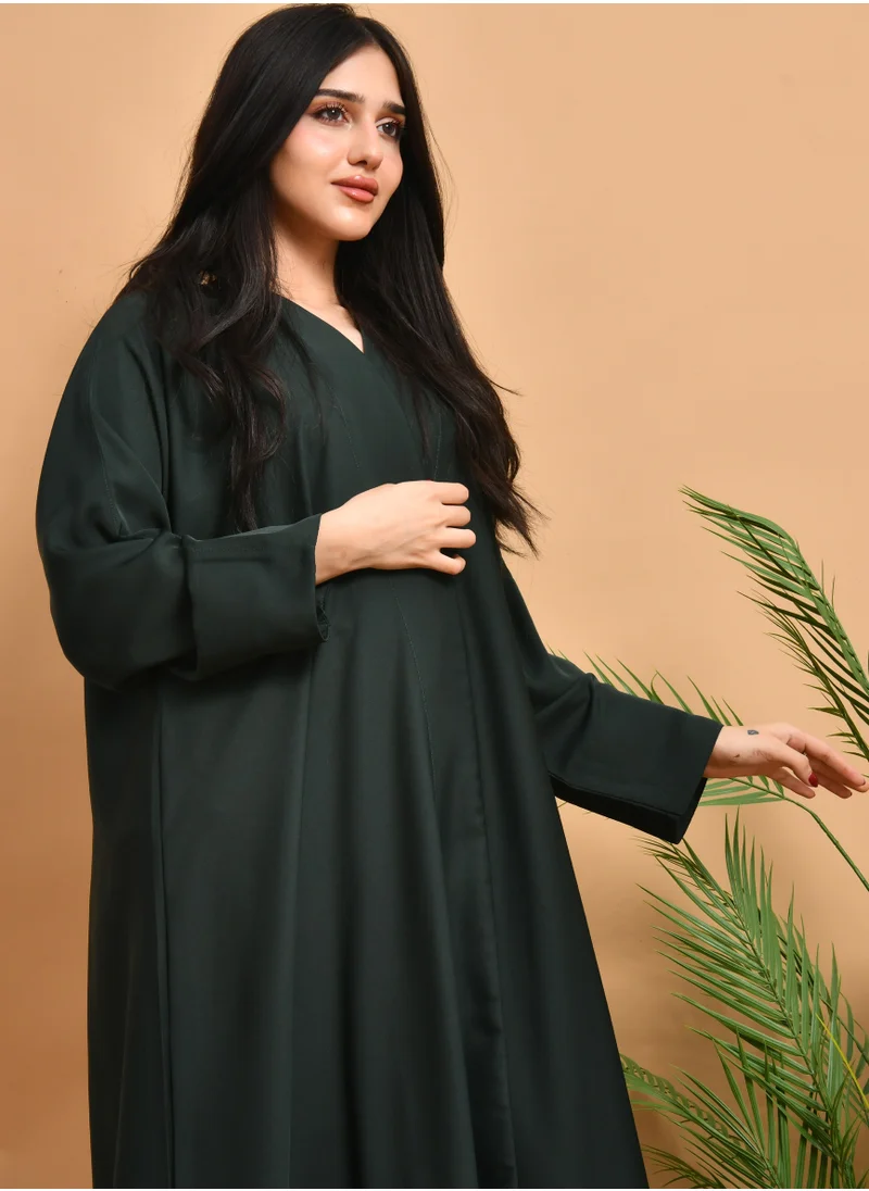 HAWRAA ABAYA Green wrap abaya, quarter cloche, with a practical design