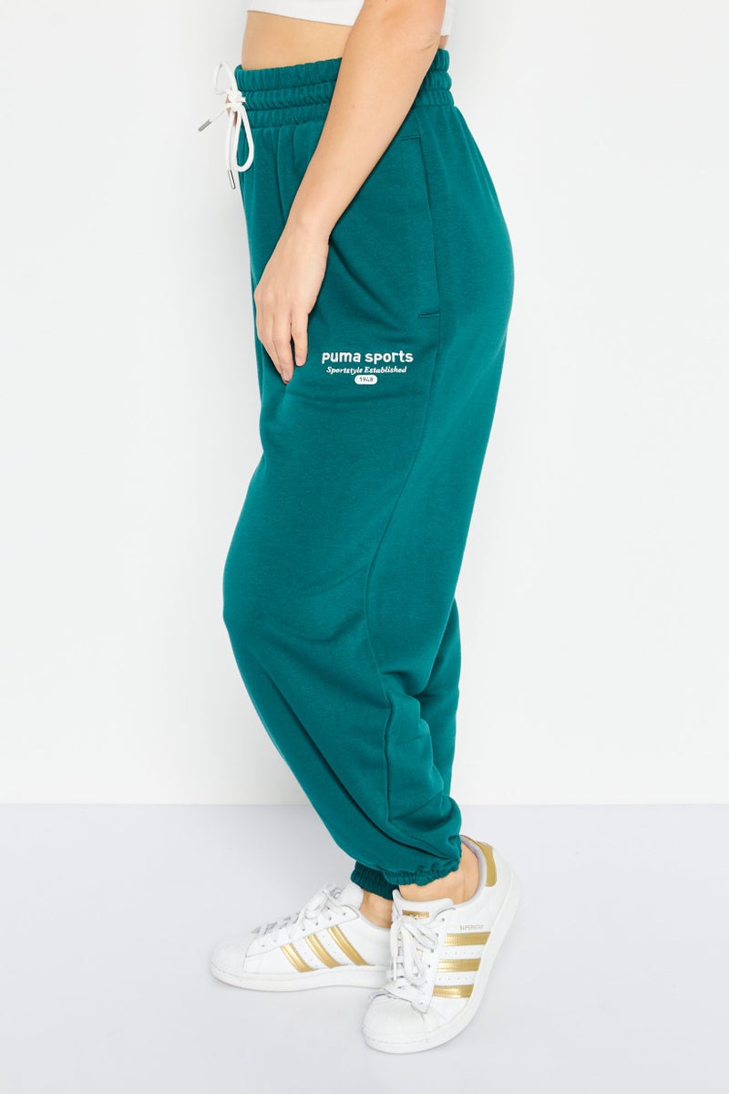 PUMA سروال رياضي خارجي مزين للنساء بتصميم مريح، أخضر - Image 2