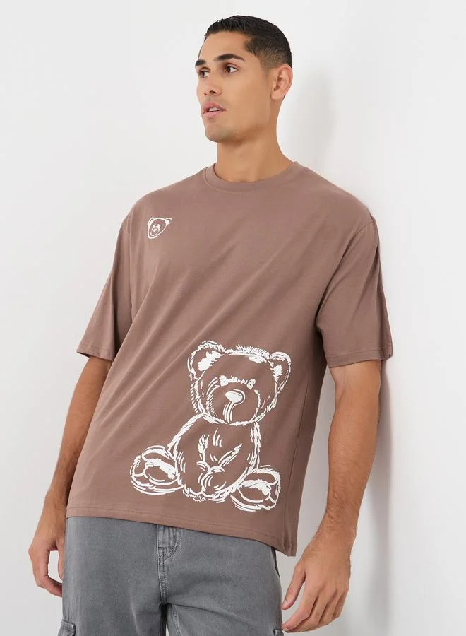 ستايلي Styli Graphic Print Oversized Round Neck T-Shirt