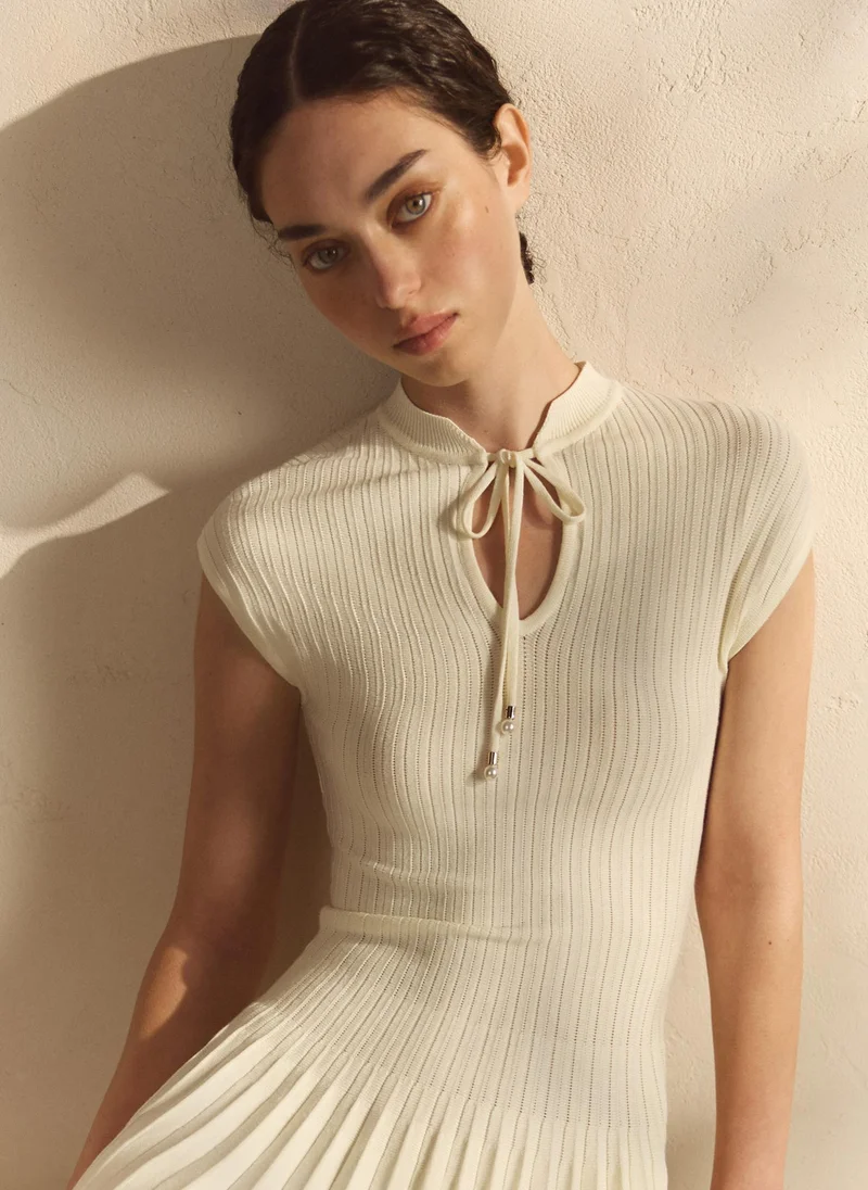 Lichi  Ribbed viscose mini dress with pleated skirt for Women | Best Price UAE