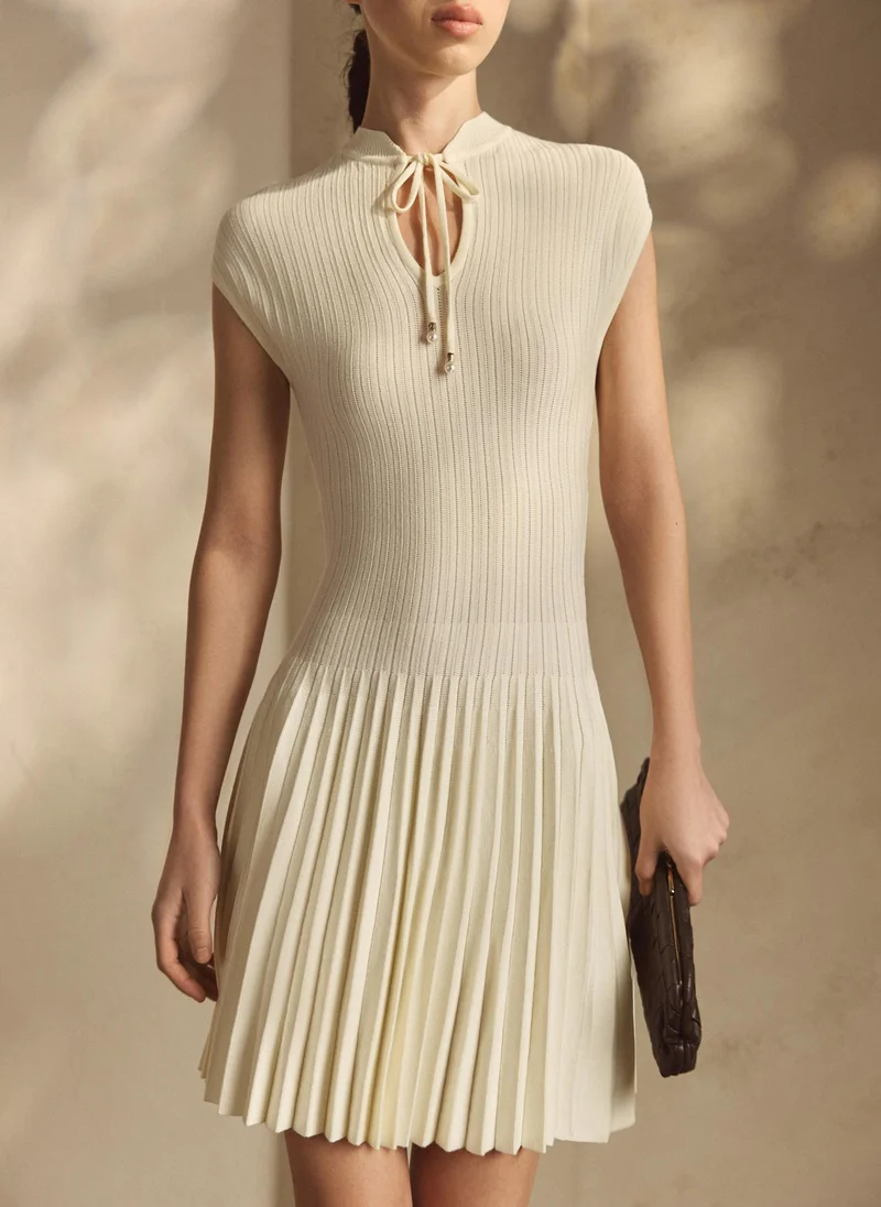 Ribbed viscose mini dress with pleated skirt