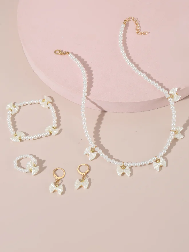 تايك تو Take Two Set of 4 - Bow Pendant Faux Pearl Necklace, Bracelet Earrings and Ring