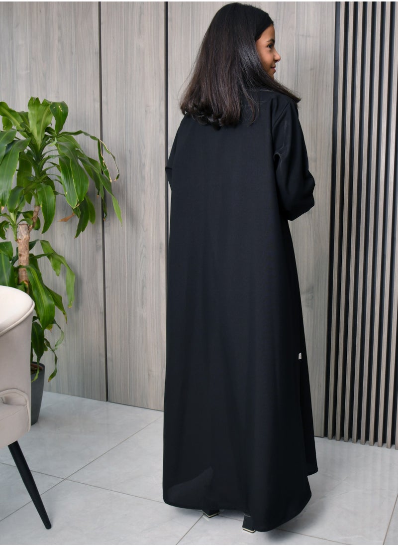 HAWRAA ABAYA - Black wrap abaya with a formal collar, front buttons, and cloche cut - Image 1