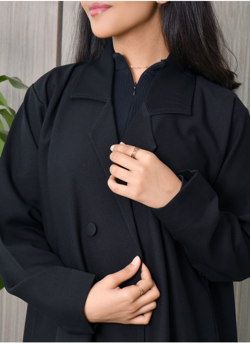 HAWRAA ABAYA - Black wrap abaya with a formal collar, front buttons, and cloche cut - Image 1