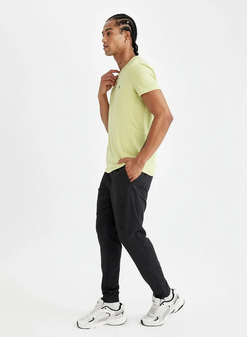 ديفاكتو بنطلون رياضي ضيق بجيوب مزدوجة وسحاب