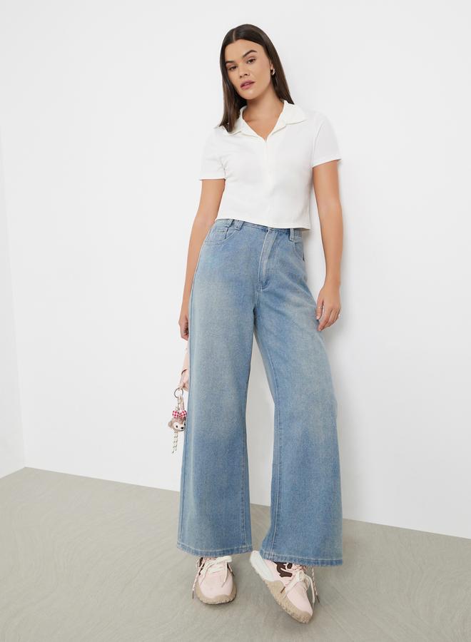 ستايلي جينز بأرجل واسعة وخصر عالي مع تفاصيل باهتة - Image 1