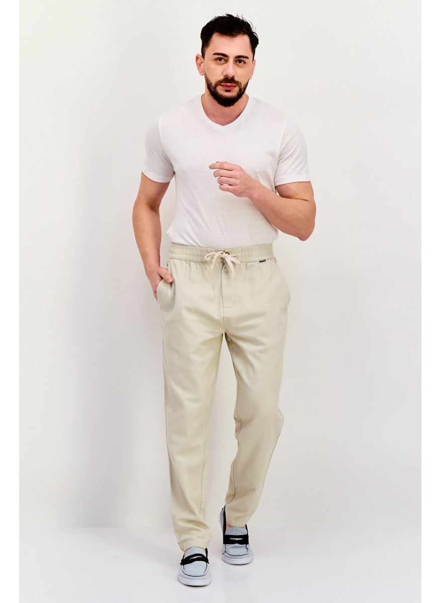 Men Regular Fit Embroidered Logo Straight Leg 14 Inseam Pants, Cream - pzsku/ZC9A10A74C67E4822E48EZ/45/_/1737642082/61c27b17-3b65-4eb8-b5ce-806f3b7ced7d