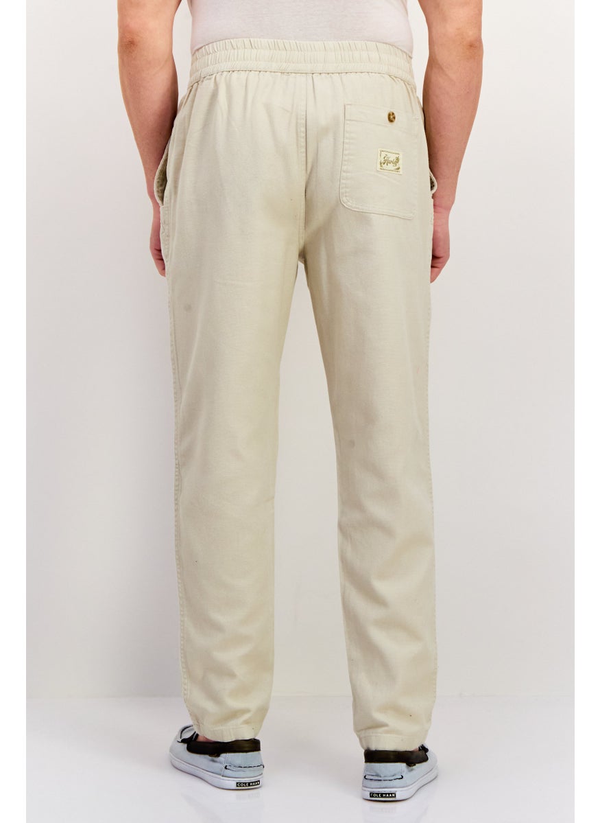 Men Regular Fit Embroidered Logo Straight Leg 14 Inseam Pants, Cream - pzsku/ZC9A10A74C67E4822E48EZ/45/_/1737642091/6a3ac4dc-4bde-4641-a3c5-e24f7f09da23