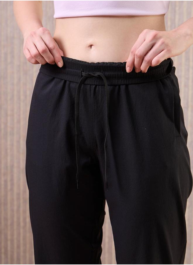 Technosport Technosport Women Black Solid 2-Way Stretch Joggers  - Image 5