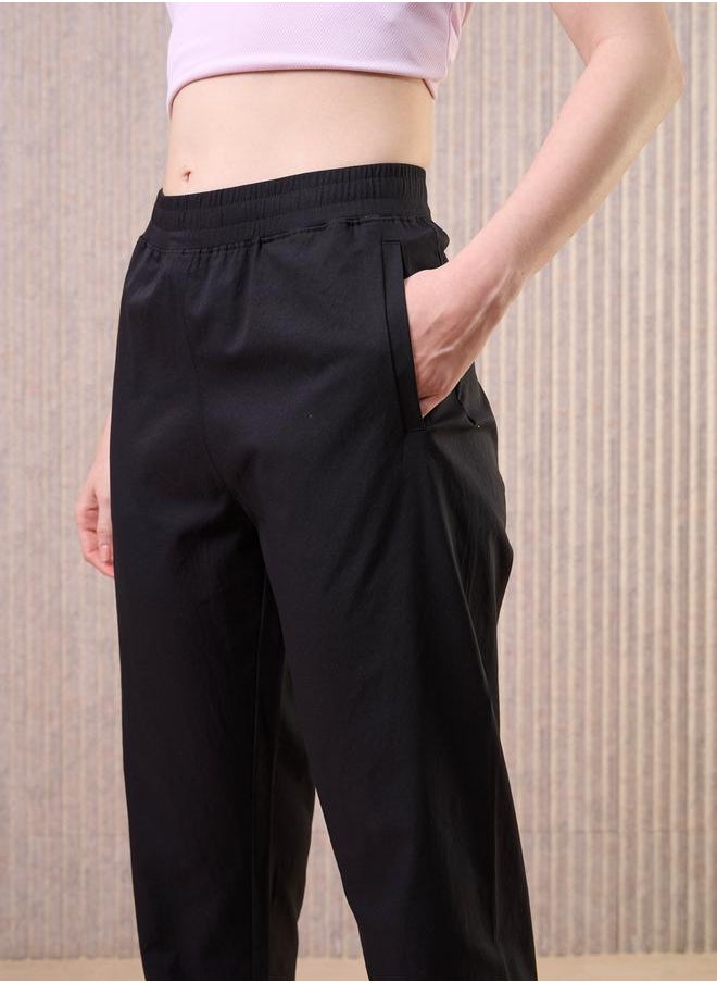 Technosport Technosport Women Black Solid 2-Way Stretch Joggers  - Image 4