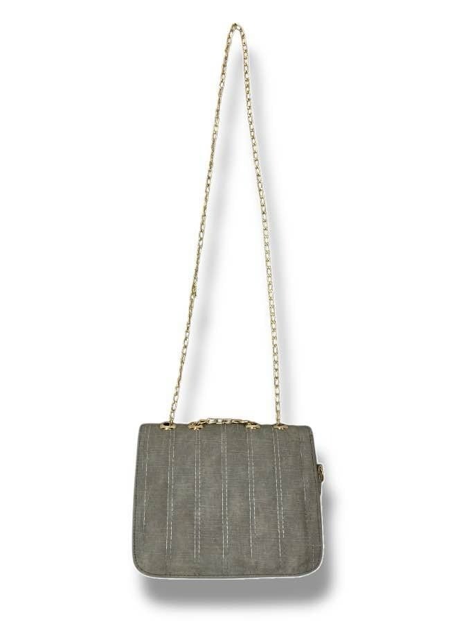 A grey imported leather crossbody bag with elegant details and practical compartments. - Image 4