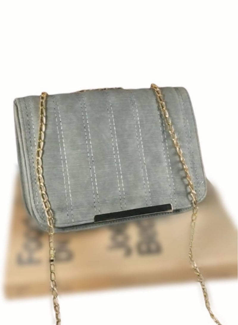 A grey imported leather crossbody bag with elegant details and practical compartments. - Image 1