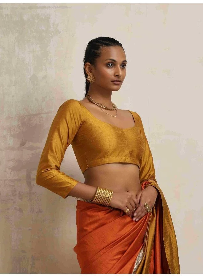 ترو برونز بلوزة حرير ذهبية