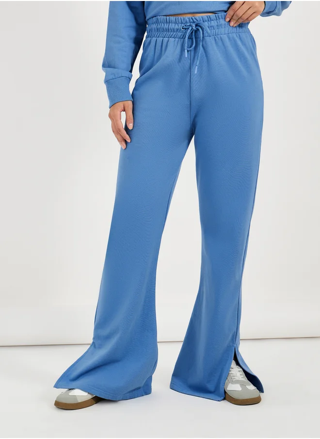 Styli Solid Drawstring Waist Flared Joggers with Side Slit