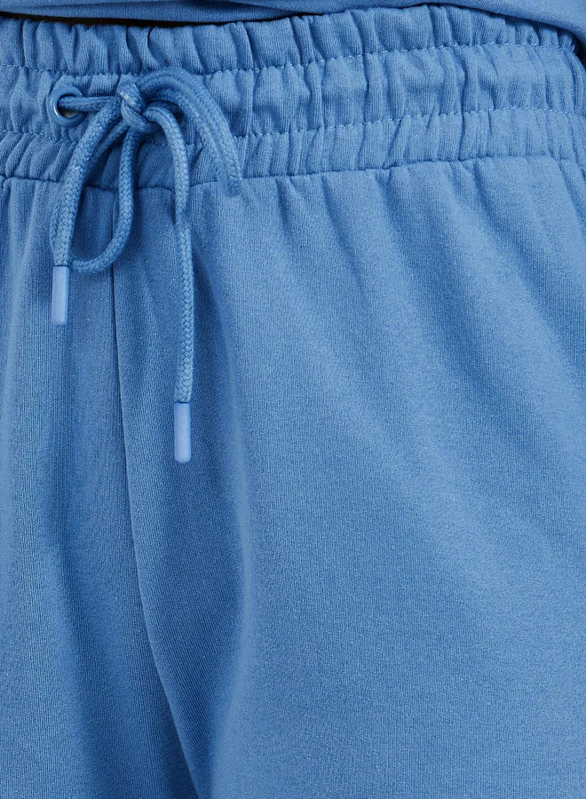 Styli Solid Drawstring Waist Flared Joggers with Side Slit