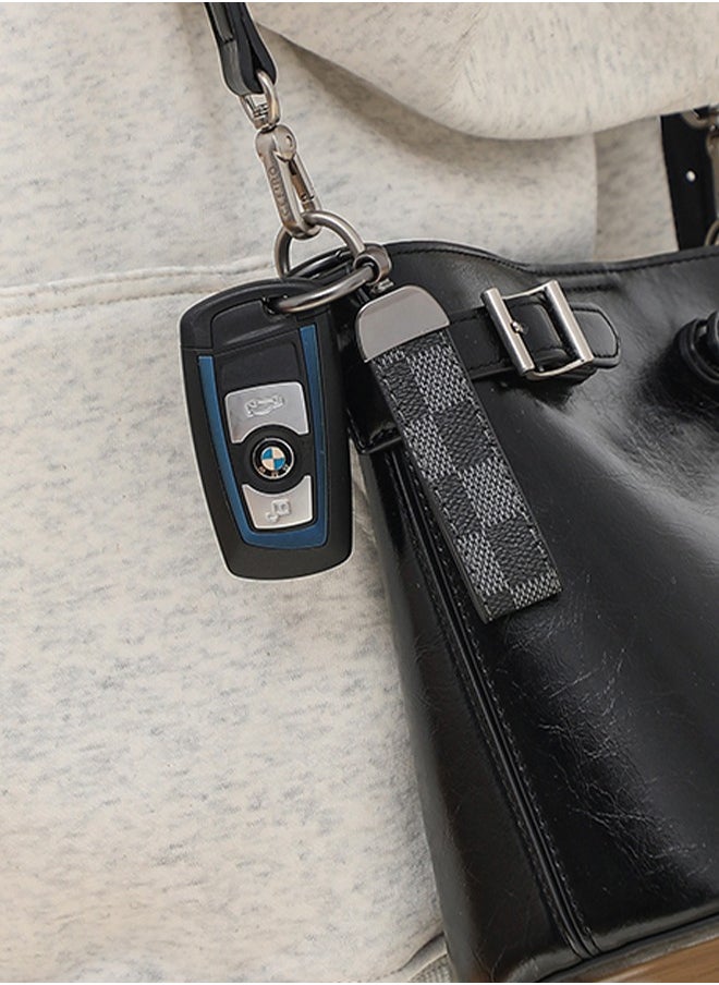 KeyAmor - Elegant metal and leather keychain car key holder for adults. Stylish keychain with gunmetal-coloured rings, perfect for men, featuring 3 key rings for added functionality. Made with elegant and refined grey and black leather, it offers 360-degree rotation for convenience and comes beautifully packaged in a fancy gift box, making it an excellent accessory or gift choice. - Image 1