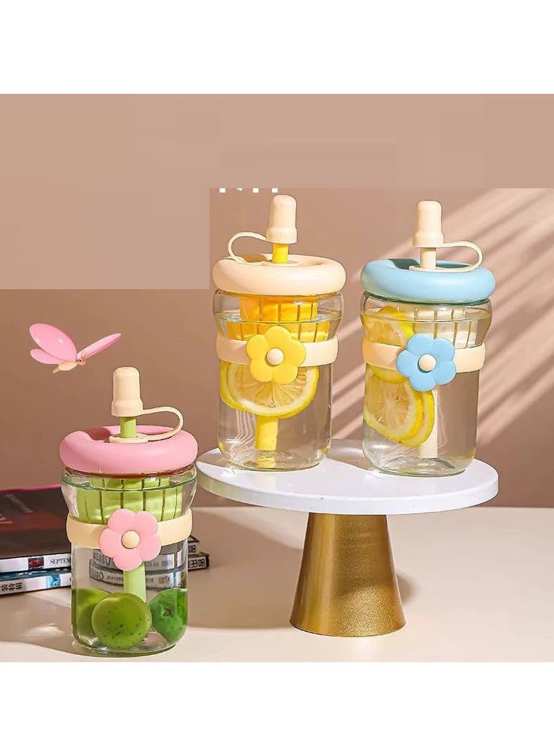 A glass mug with a rose straw and a plastic fruit strainer for easily preparing refreshing drinks. - Image 1