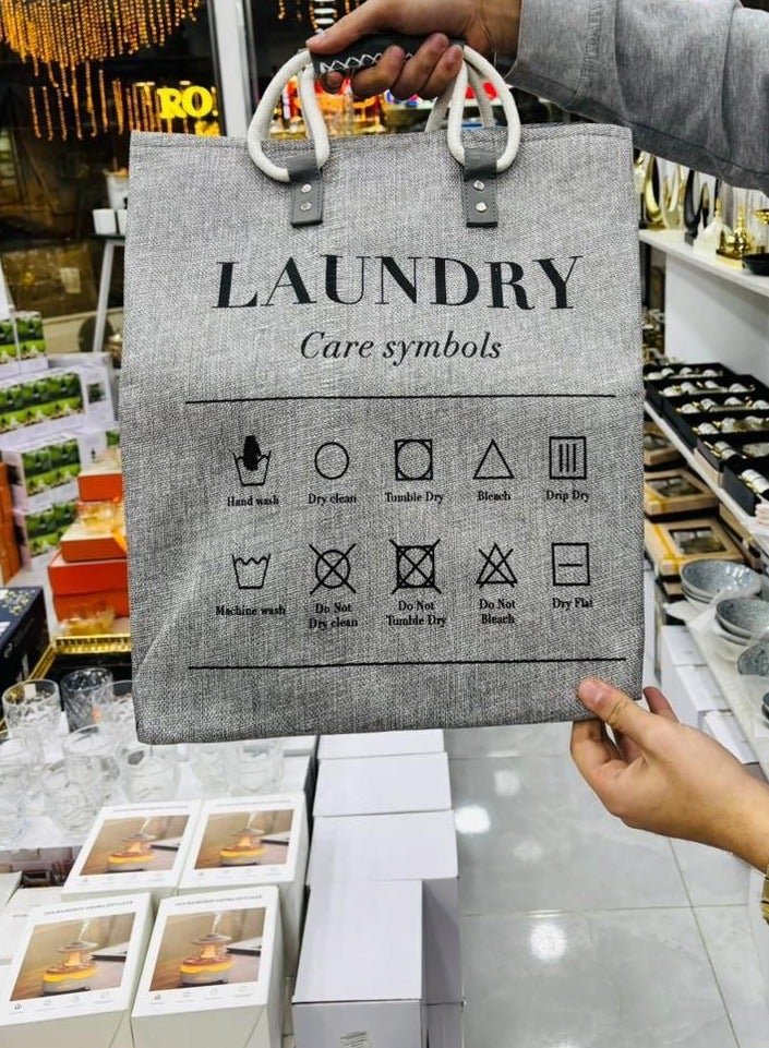 A basket, laundry basket, clothes basket, or children's toy cabinet, the newest, most elegant, and highest quality. Most importantly, it is jumbo in size and also has a leather handle. The material is heavy linen, lined on the inside. It is used for washing or toys. Since the basket is elegant and different, it can be placed in rooms to add an aesthetic look. Size: 45 x 40 x 40. Multi-colored.
