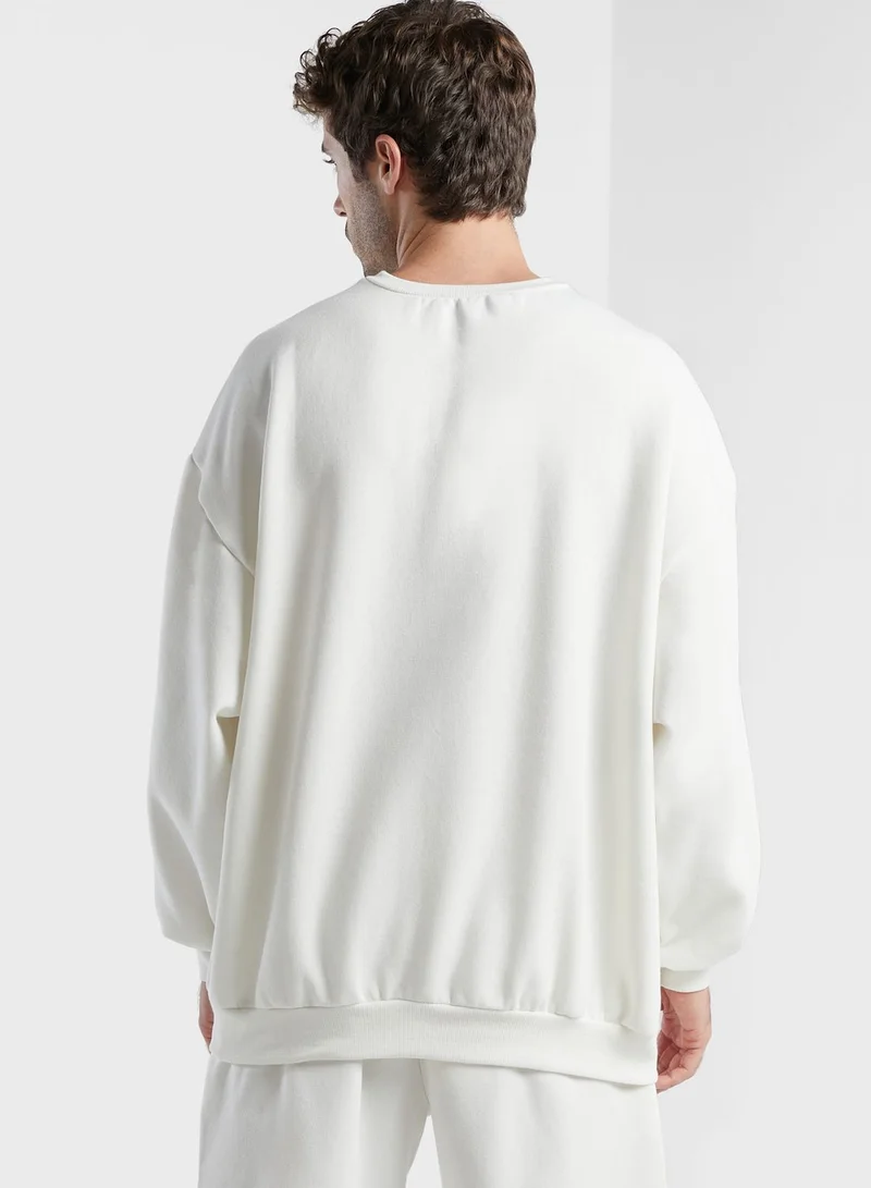 The Giving Movement Regular Sweatshirt