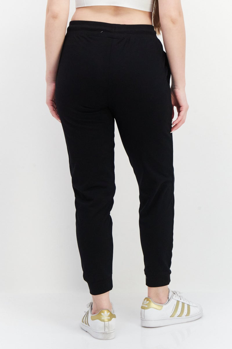 Warner Bros سروال جوجر بسحاب للنساء بطبعة لوني تونز، أسود - Image 2