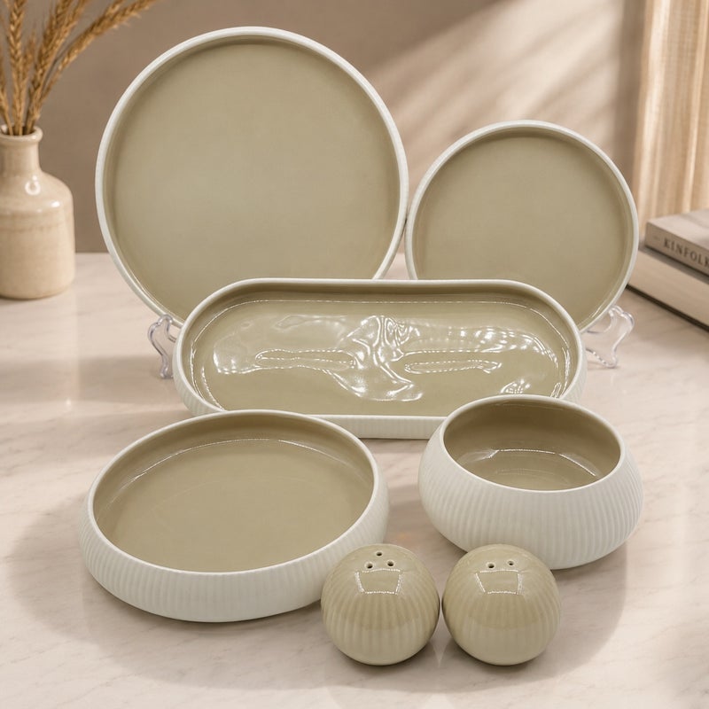 27-piece porcelain dinner set, white with a beige center, with a ribbed salt and pepper shaker.